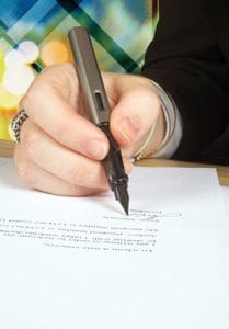 Lawyer signing document